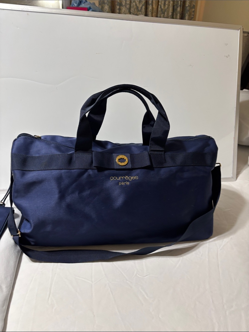 Courrèges Paris Navy blue Travel duffel with pouch and Gold hardware. Like new!